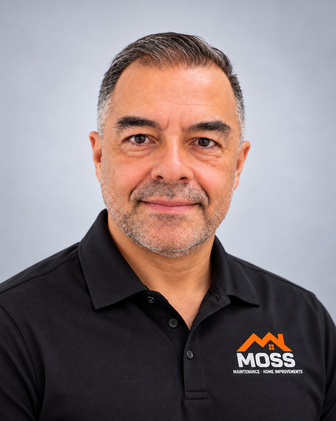 Alex Mosquera, owner of Moss Maintenance, in a black Moss Maintenance polo shirt