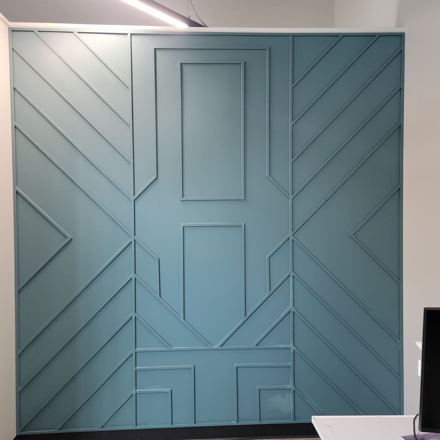 Geometric Accent Wall after in Winter Garden: custom trim pattern, built on site and painted