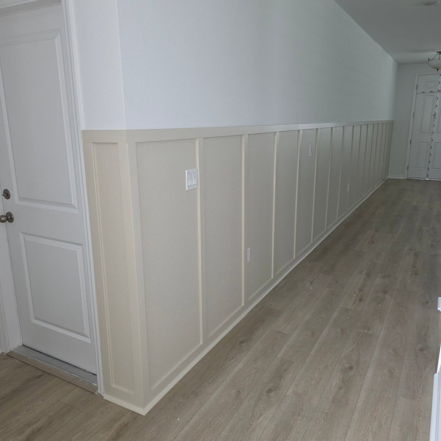 Hallway Wainscoting after in Mount Dora: board-and-batten wainscoting, trim and paint